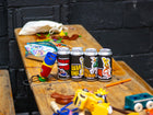 Good Chem cans surrounded by kids toys on a wooden table