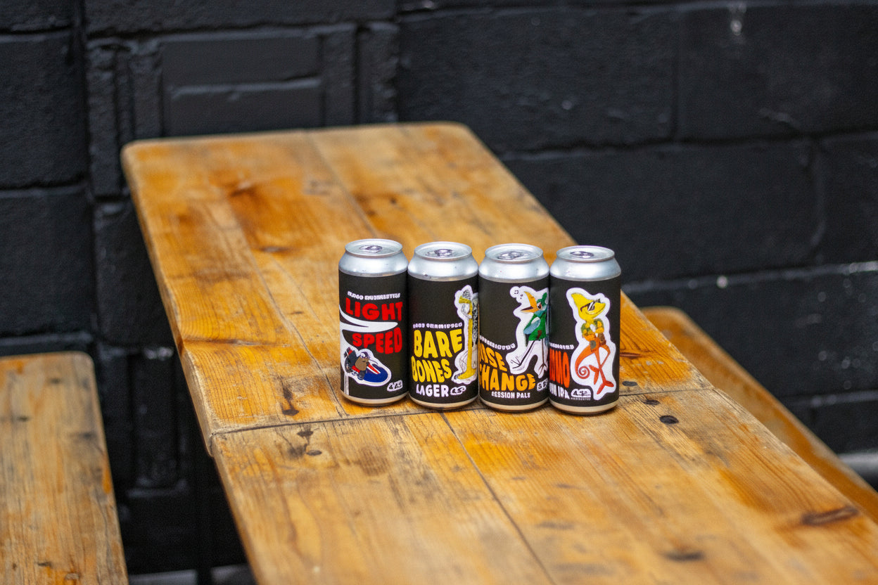 Good Chem cans surrounded by kids toys on a wooden table