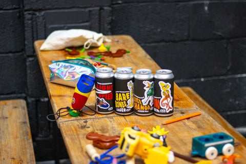 Good Chem cans surrounded by kids toys on a wooden table