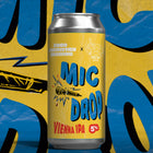 Beer can labeled 'MIC DROP Vienna IPA' on a colorful background with abstract designs.